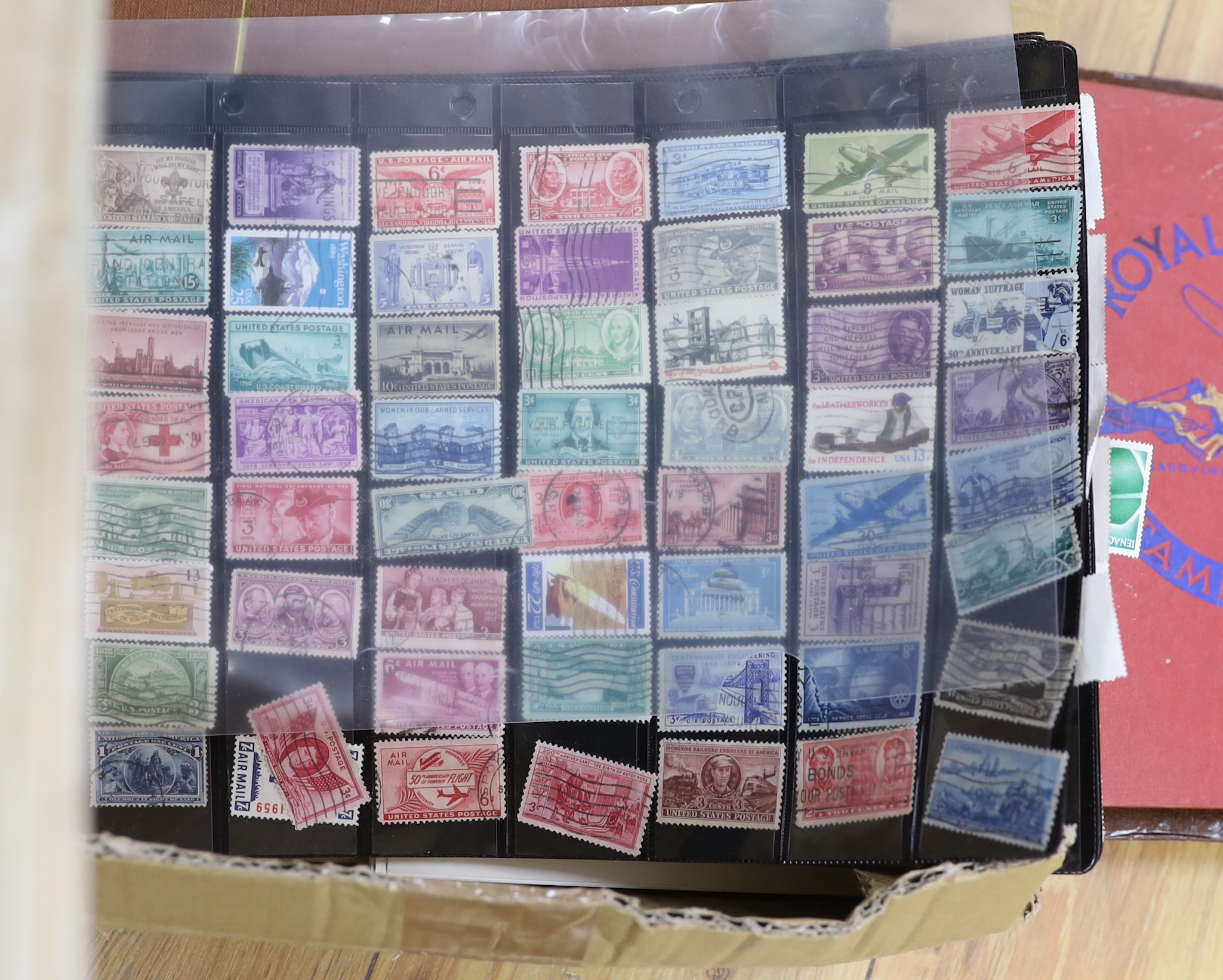 A collection of stamps and cigarette cards in two boxes